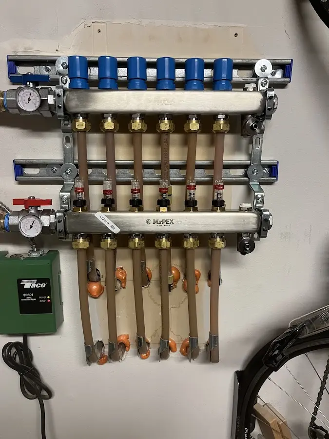 Plumber performing Water Heater Repair at a residential property in Henniker